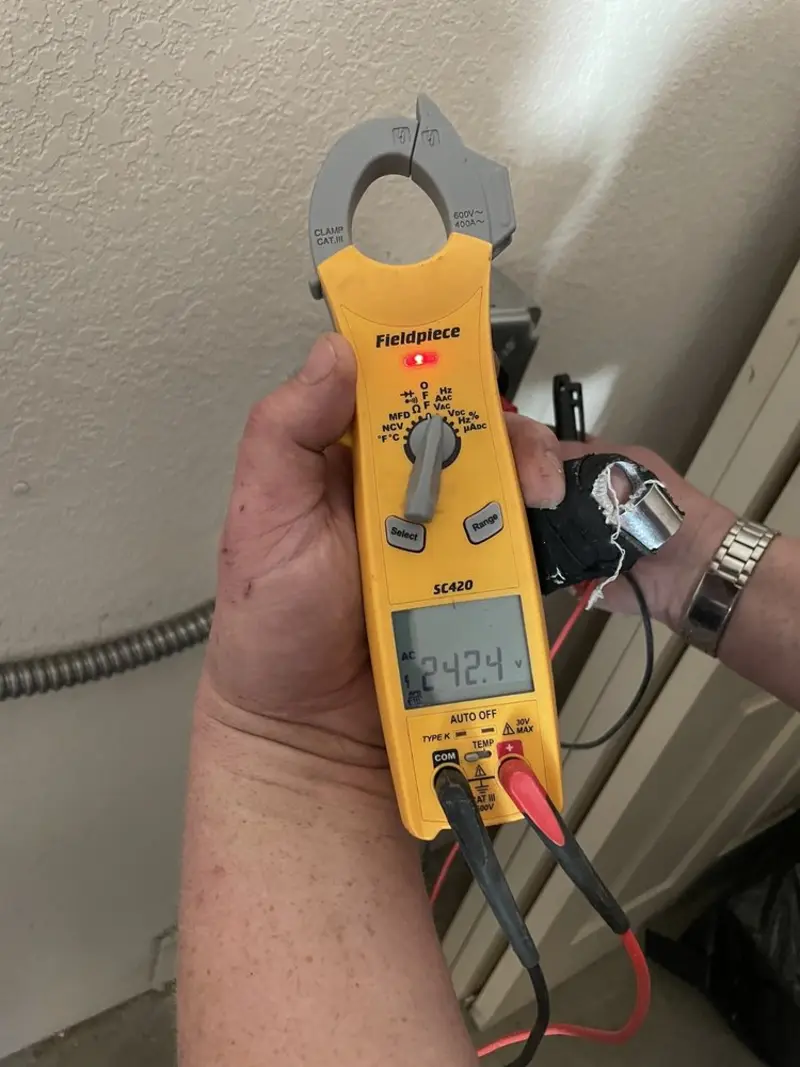 Voltage testing with clamp meter during Outlet Installation in Newburgh